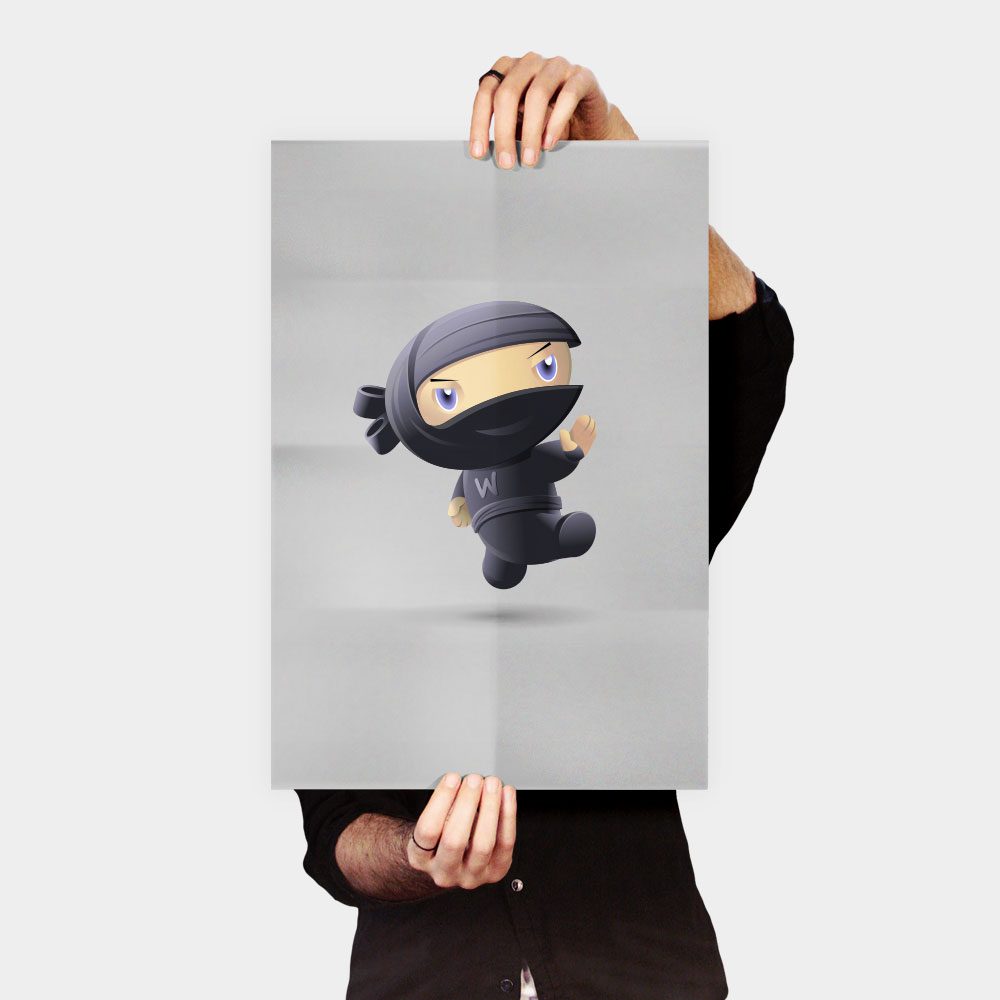 A person holding up a poster with a picture of a ninja.