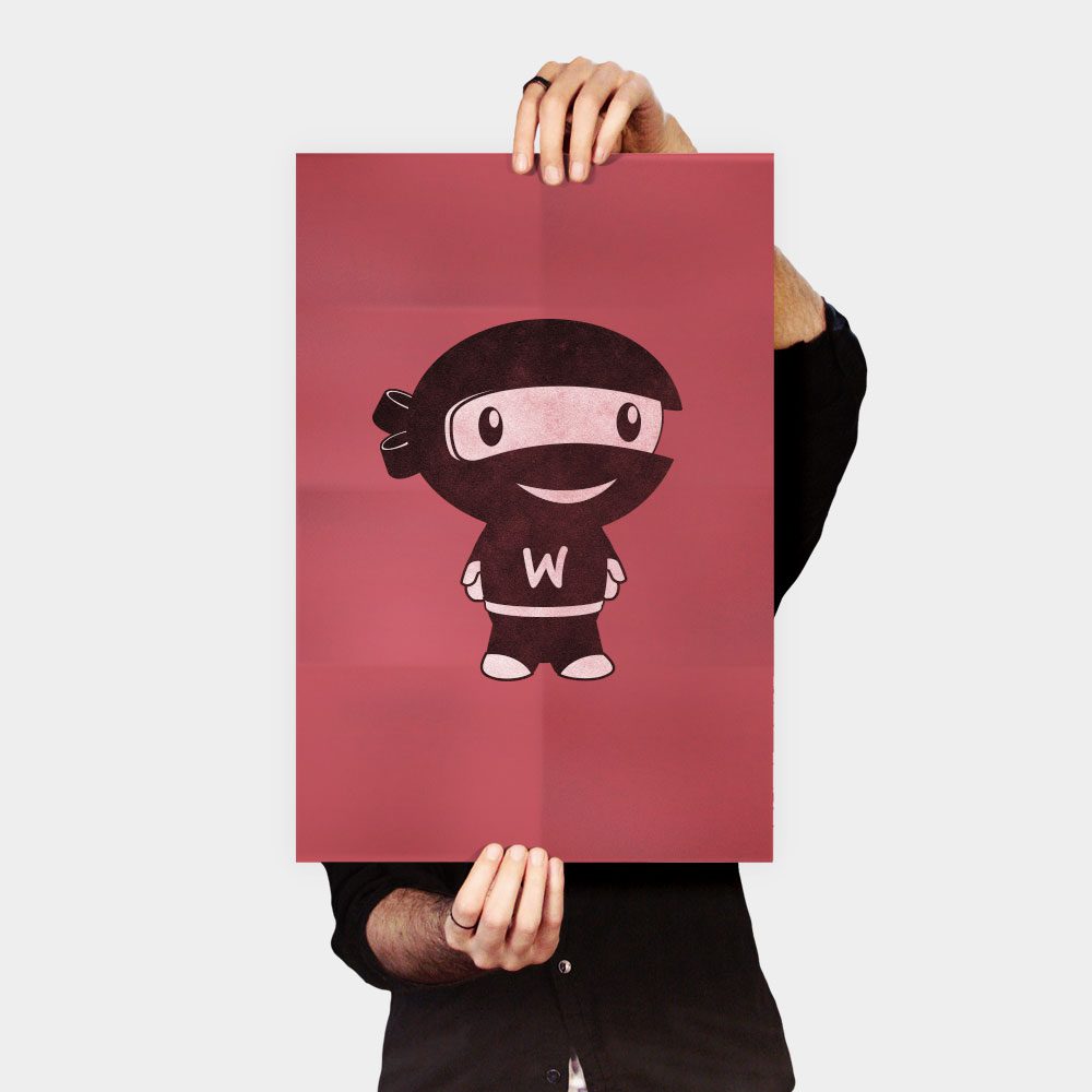 A person holding up a poster with a cartoon character.