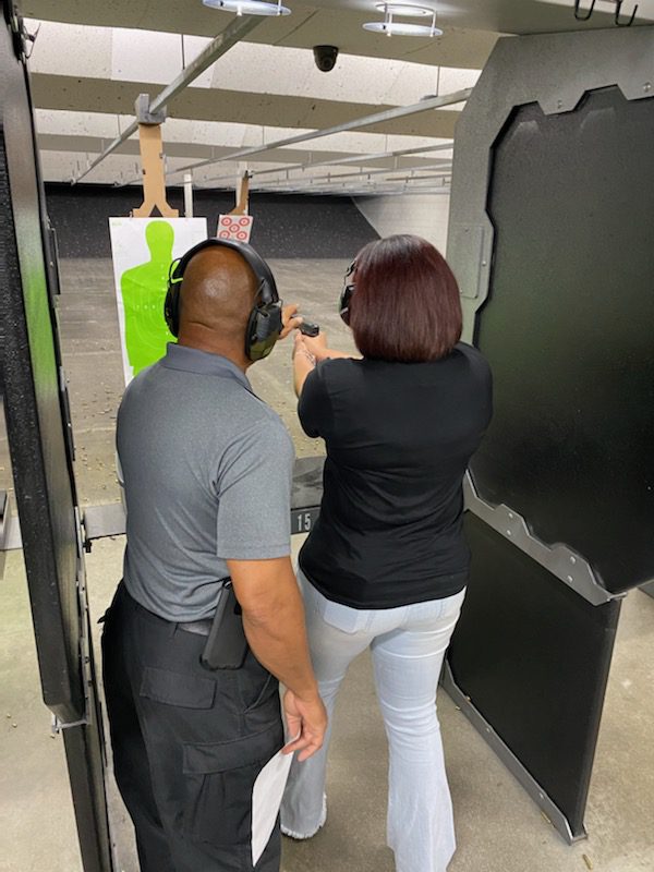 A woman is pointing at something in the air